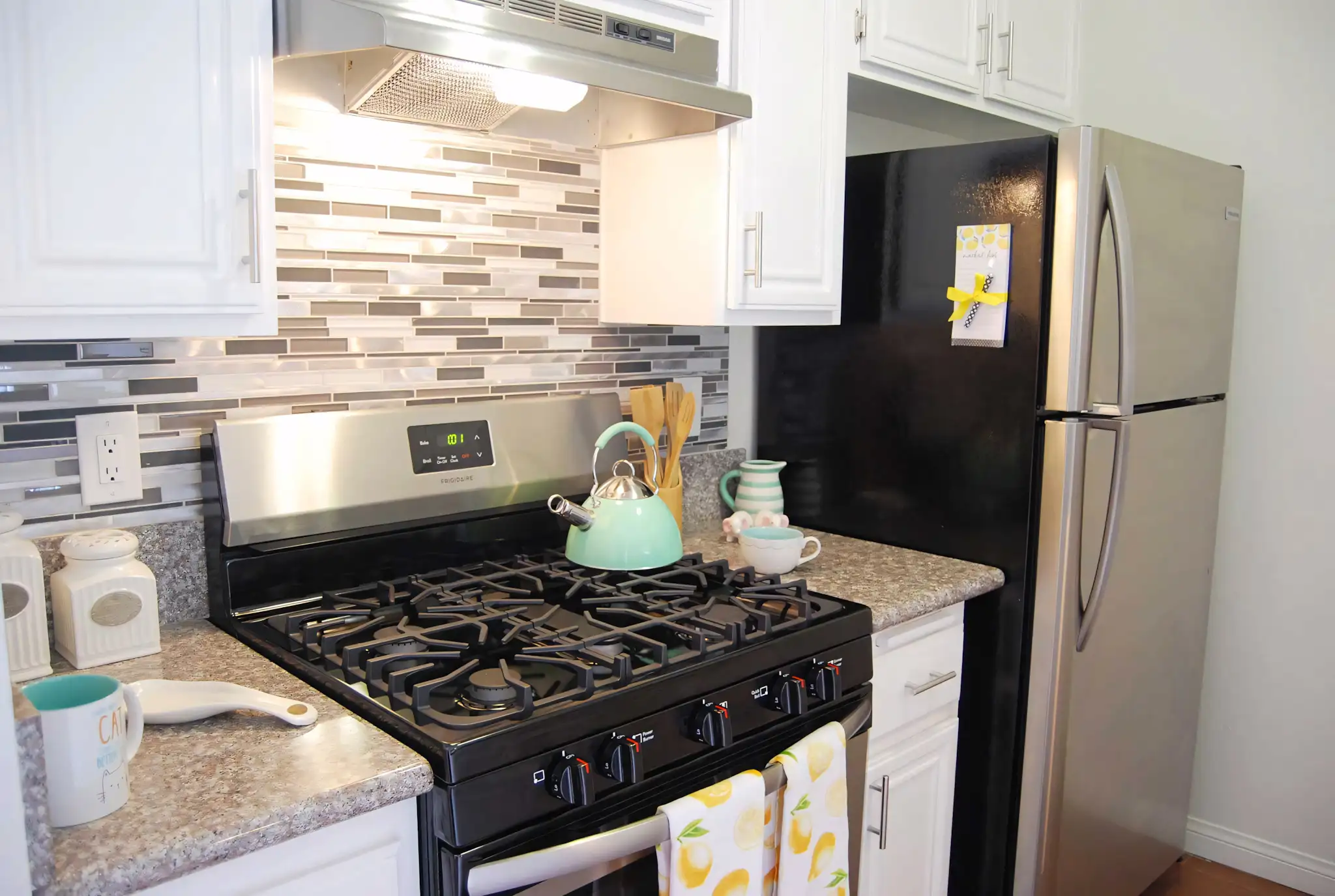 Elm Court updated kitchen with white appliances and ample storage