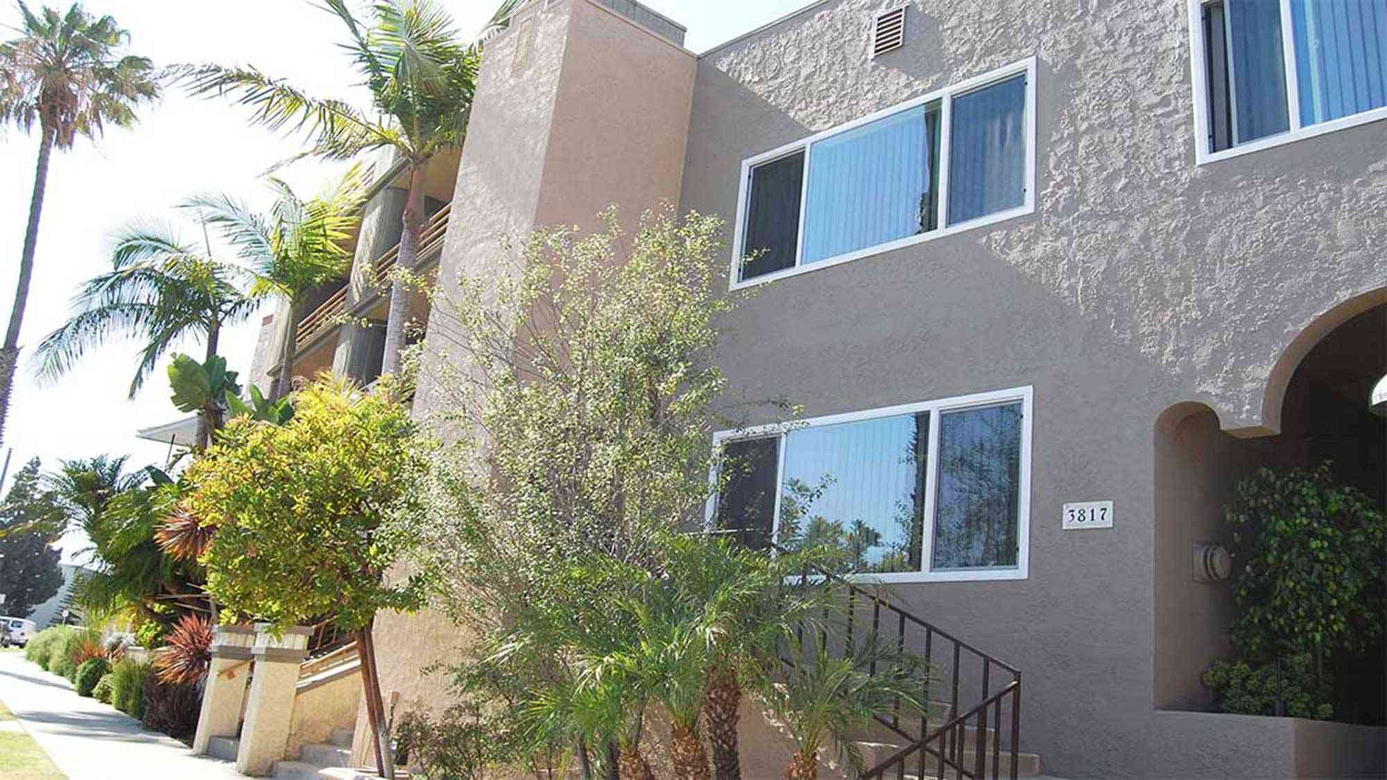 seaglass apartments exterior building facade with landscaped entryway