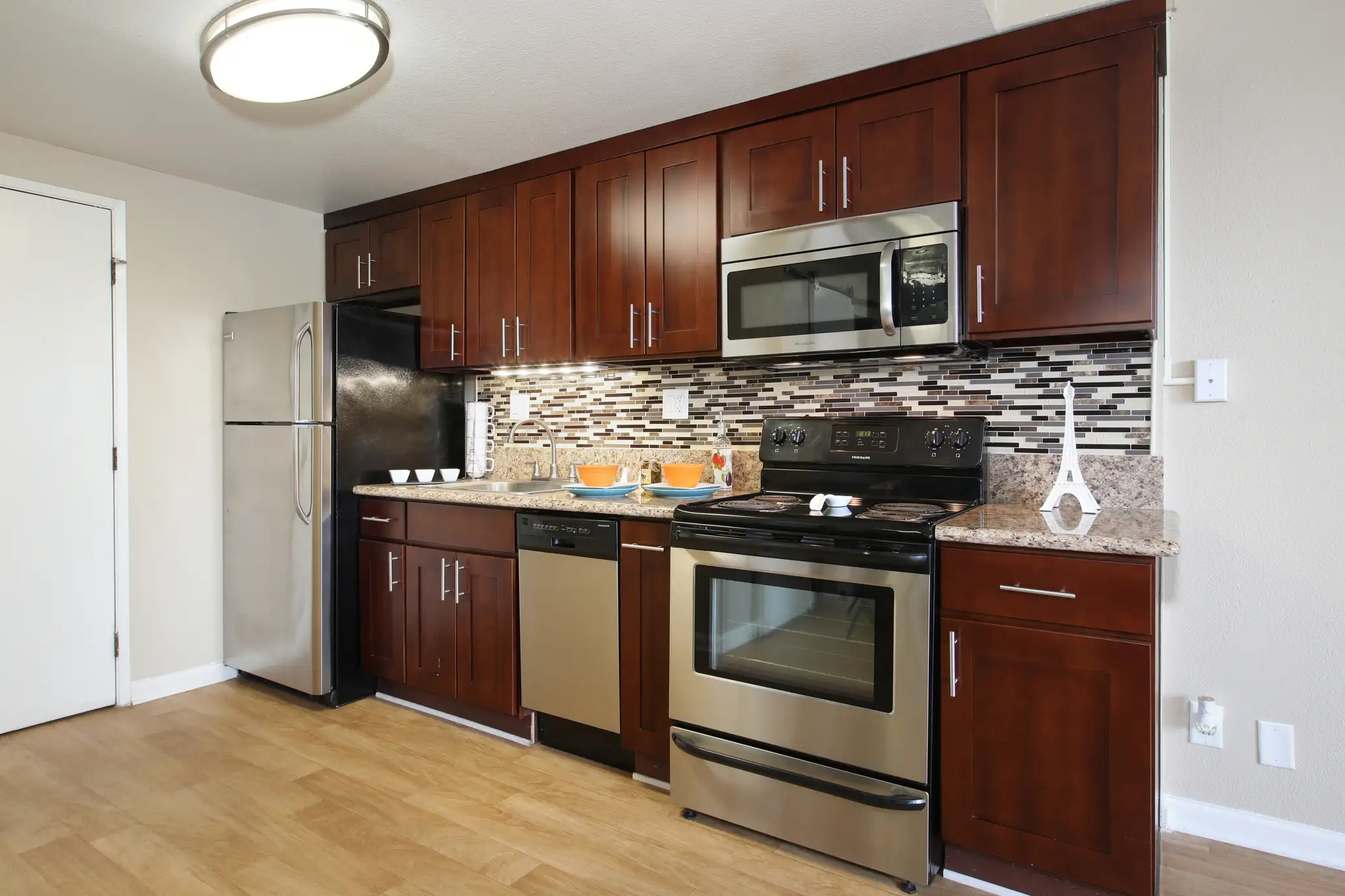 The Bixby updated kitchen with white appliances and ample storage