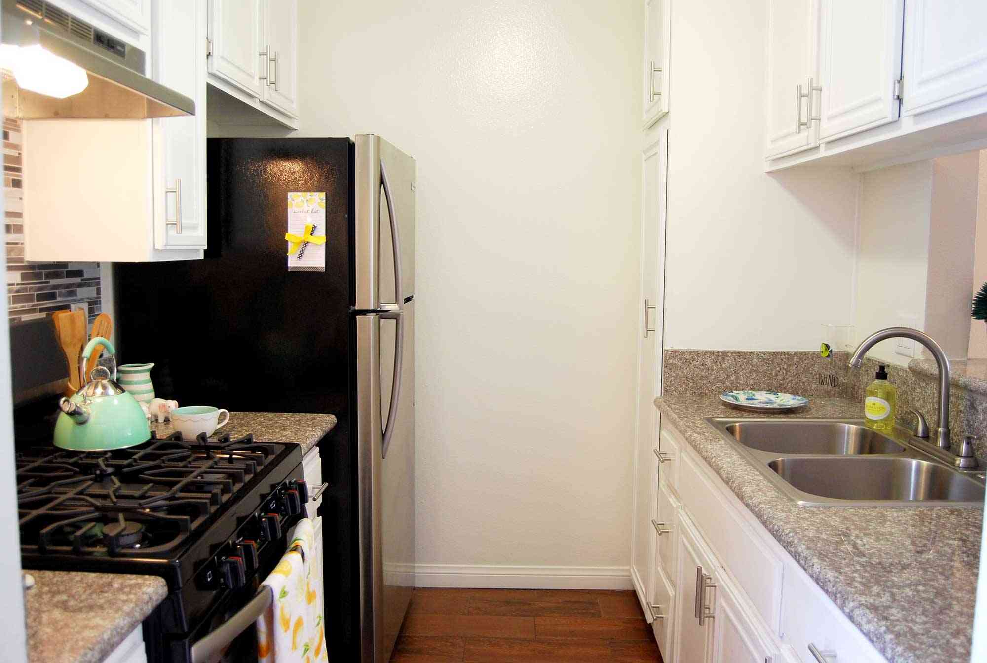 elm court apartments efficient galley kitchen with hardwood style flooring