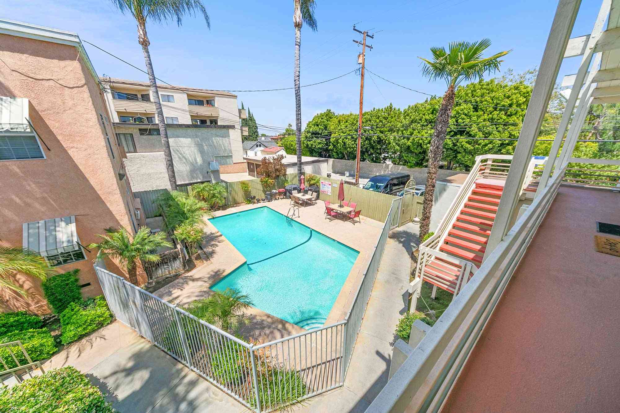 knolls on elm apartments overhead view of gated swimming pool