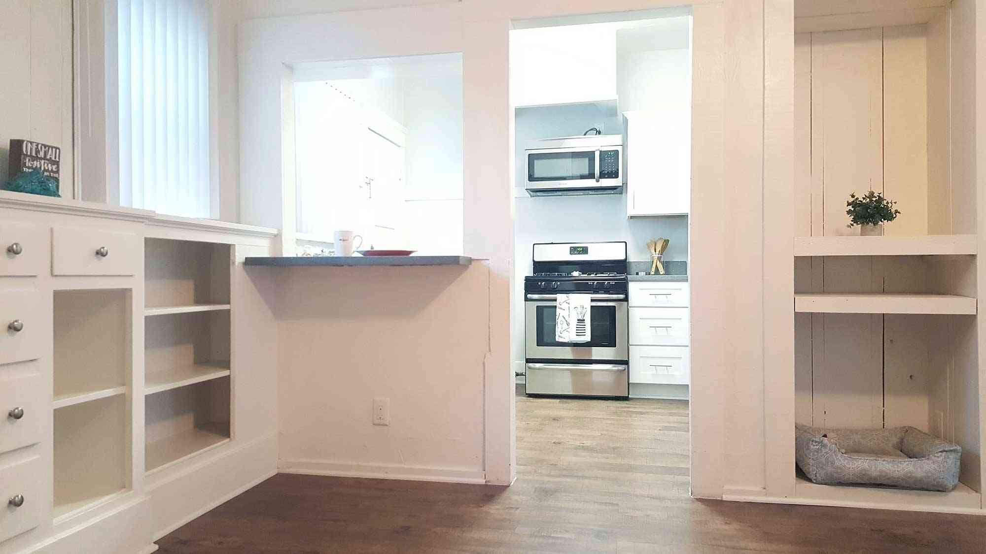 seaglass apartments open view from dining nook into updated kitchen