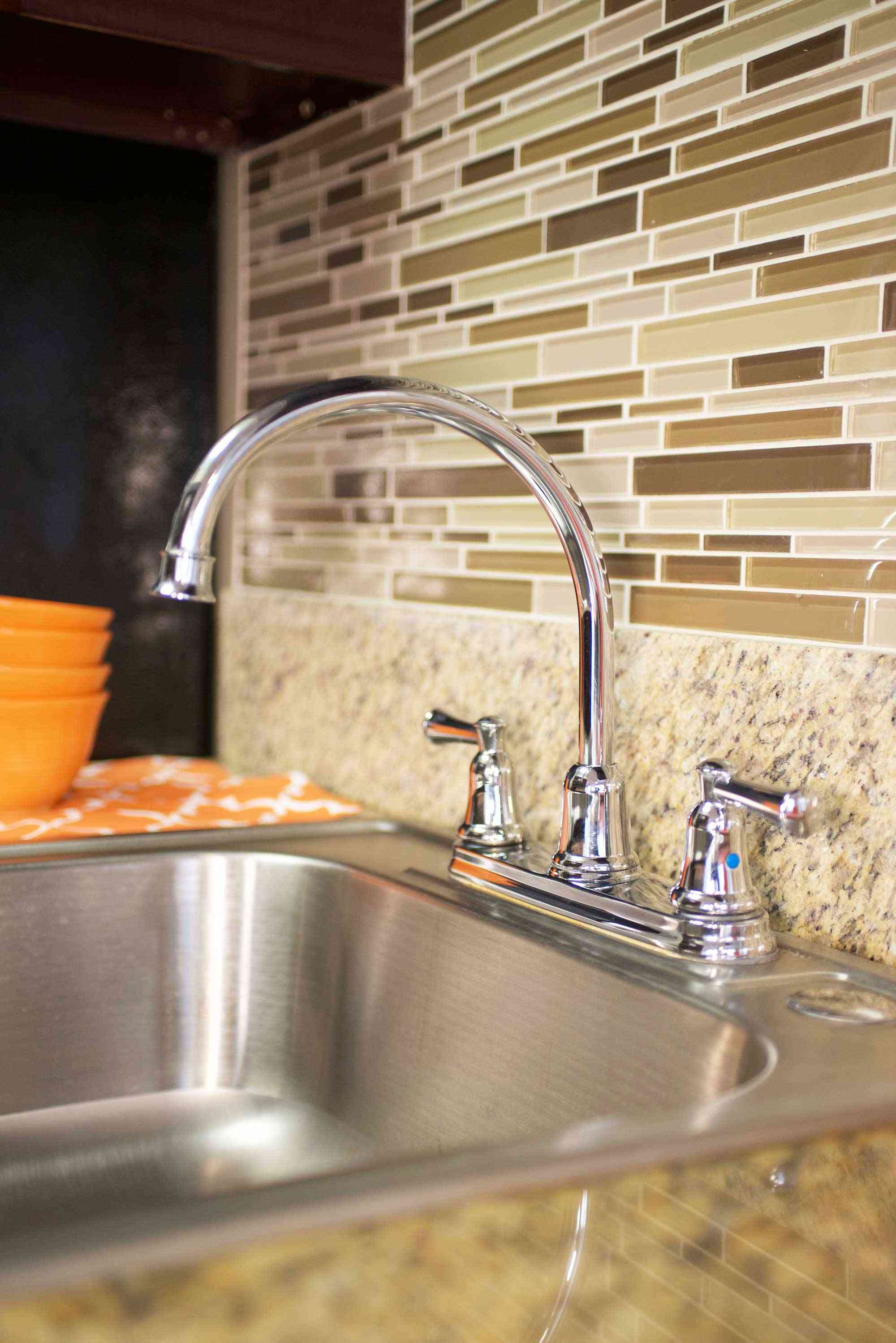 lime on 4th apartments close up of stainless steel sink and tile backsplash