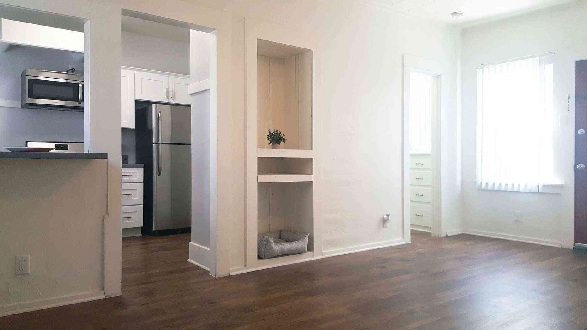 seaglass apartments open concept living area with hardwood style flooring