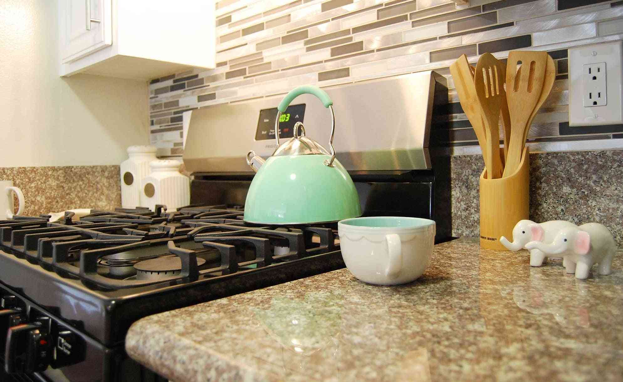 elm court apartments close up of gas range and granite countertops