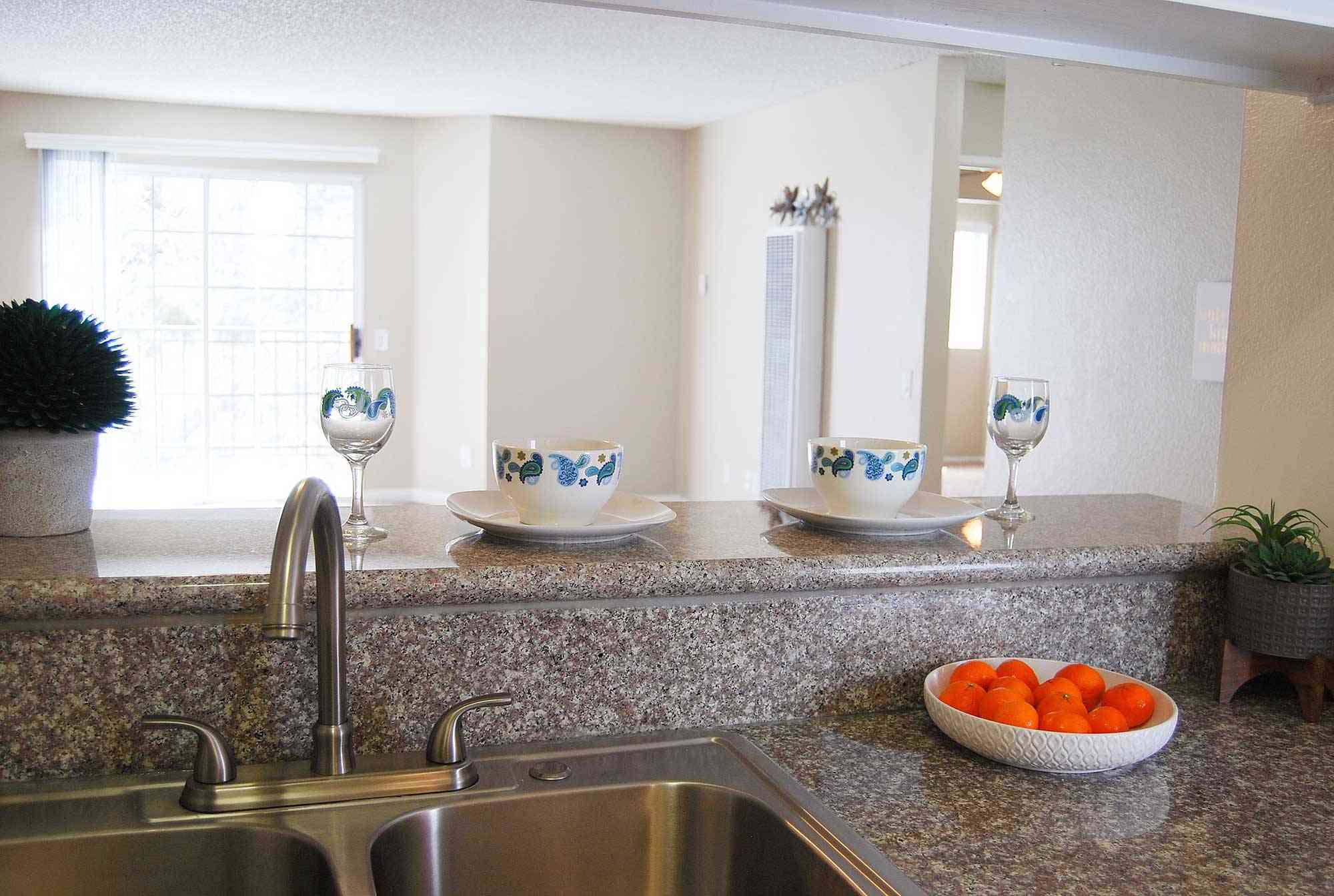 elm court apartments granite breakfast bar looking into living room