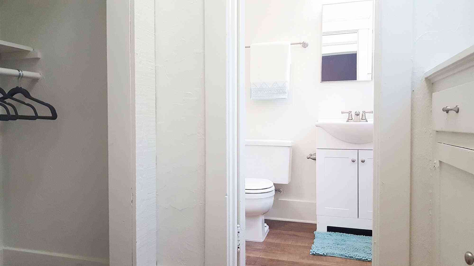 seaglass apartments renovated bathroom vanity adjacent to closet space