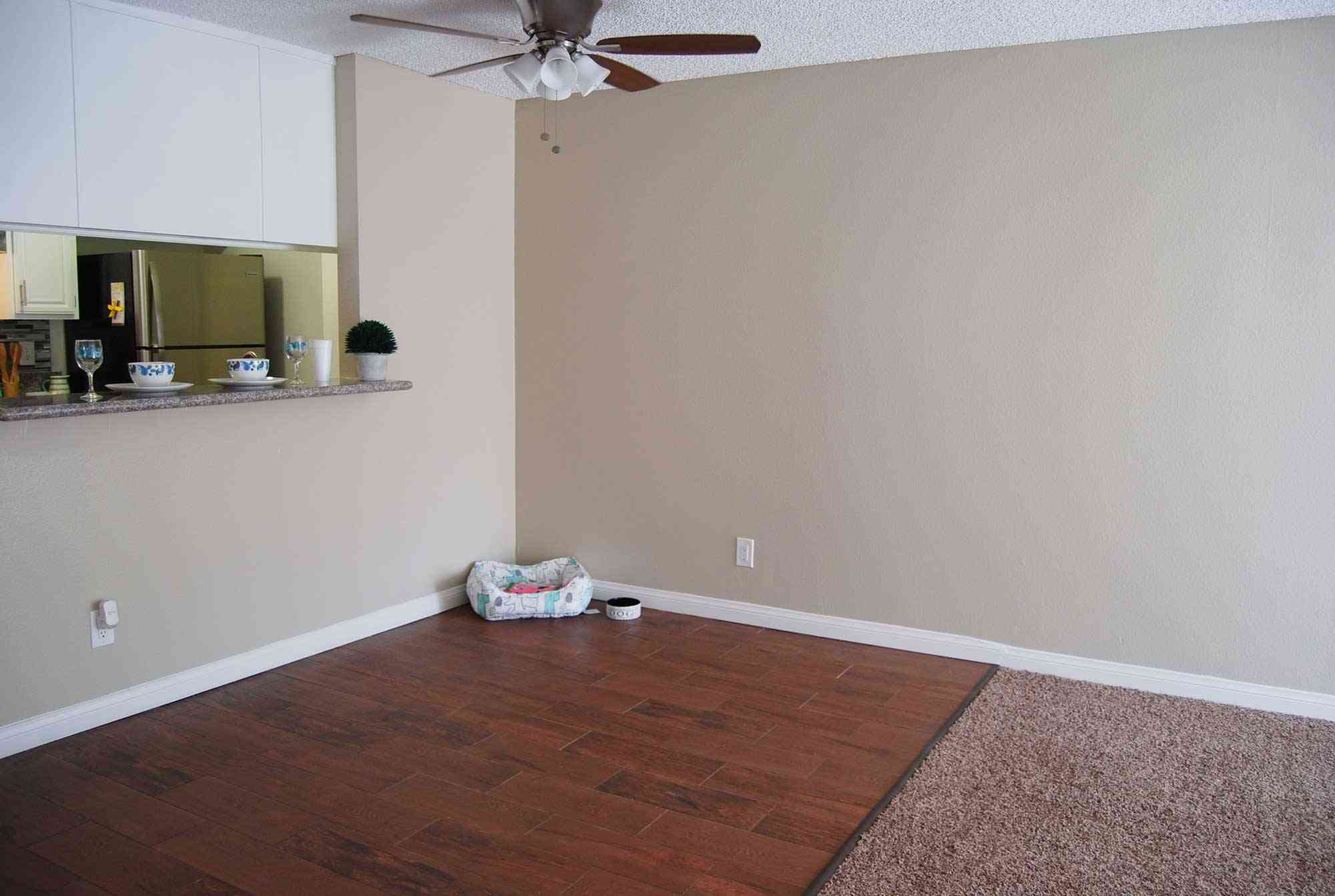 elm court apartments open living room with hardwood style flooring and carpet