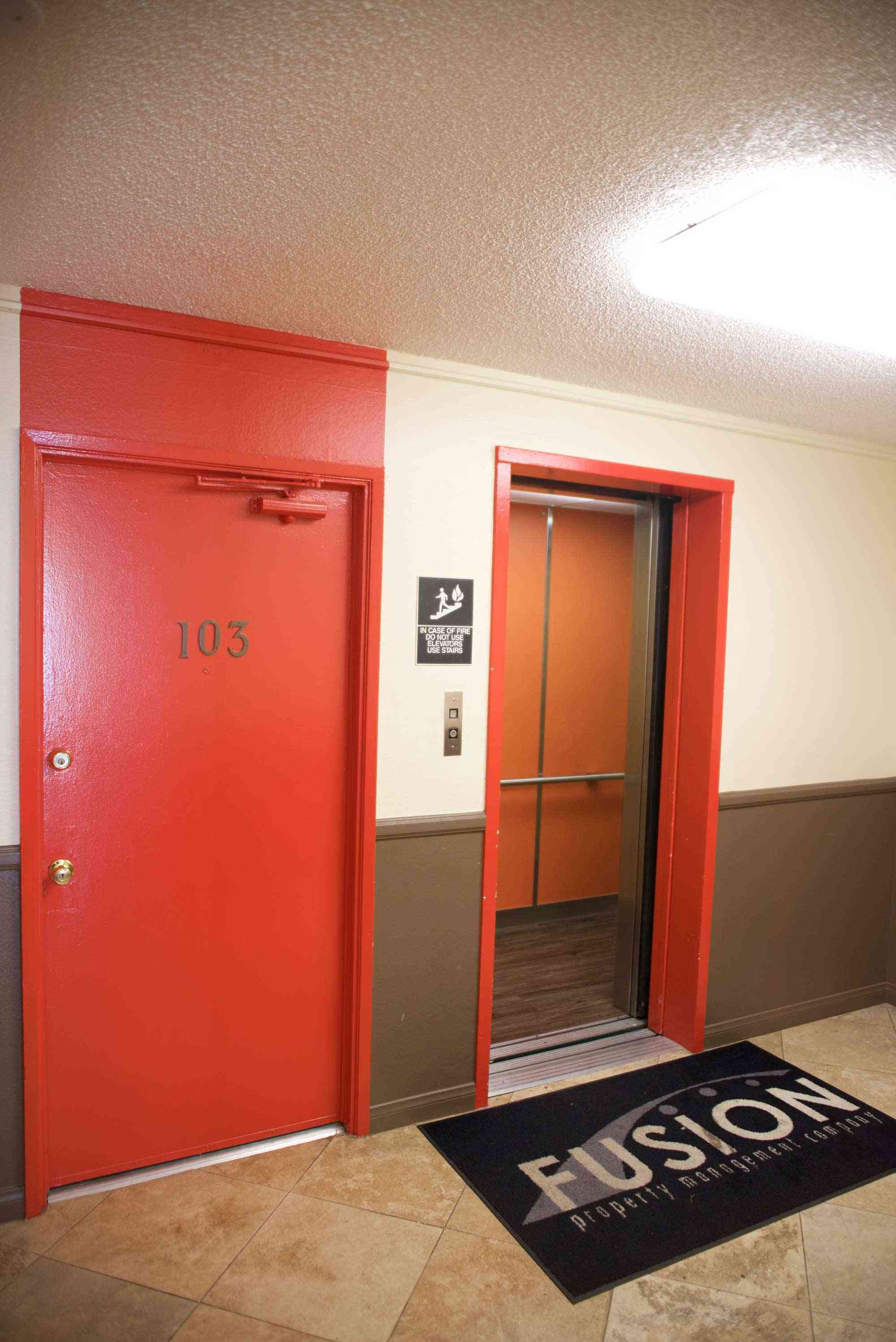 lime on 4th apartments building hallway with elevator and resident doors