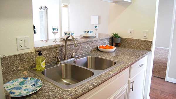 Elm Court Apartment kitchen granite countertop and sink